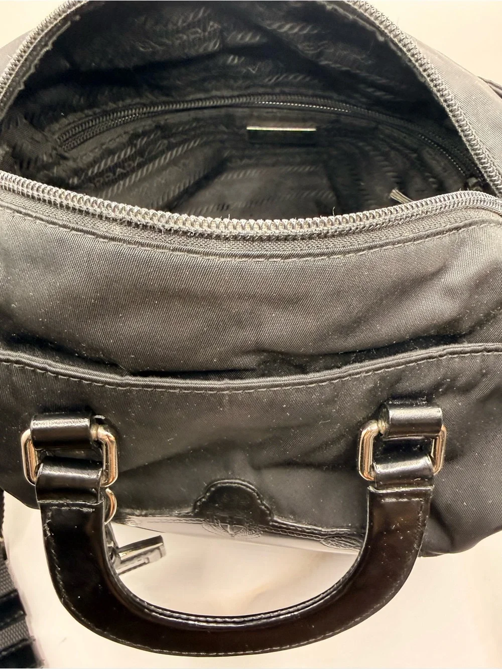 Prada Black Nylon & Leather Bag with Embossed Prada logo.